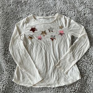 Sequined long sleeved white tee.